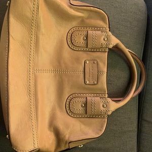 Kate spade tan handbag satchel with purple lining.